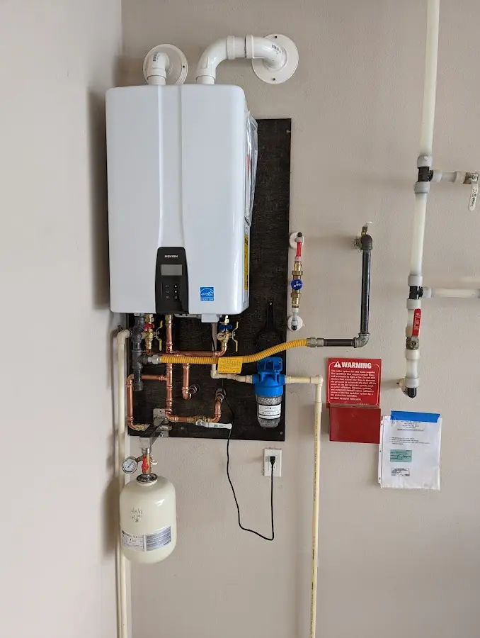 Professional plumber installing copper piping in a Lutherville home